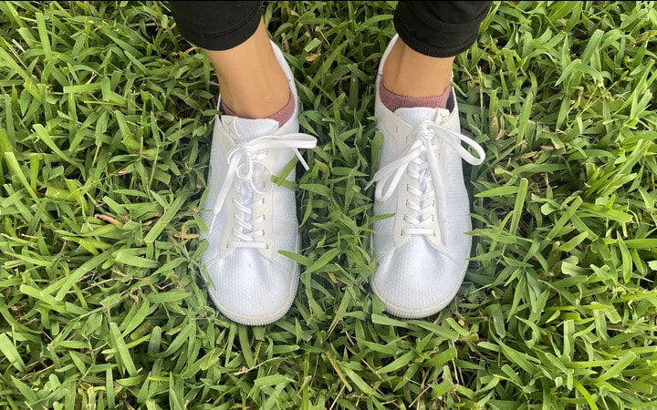 White Flux Trainer shoes in grass