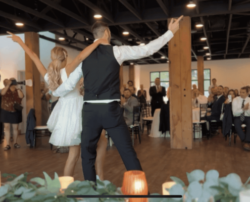 Nix finishes her first dance with her husband in front of a crowd